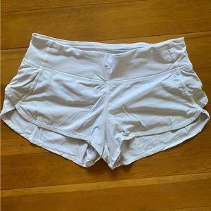 LULULEMON run speed shorts with a small stain on the back